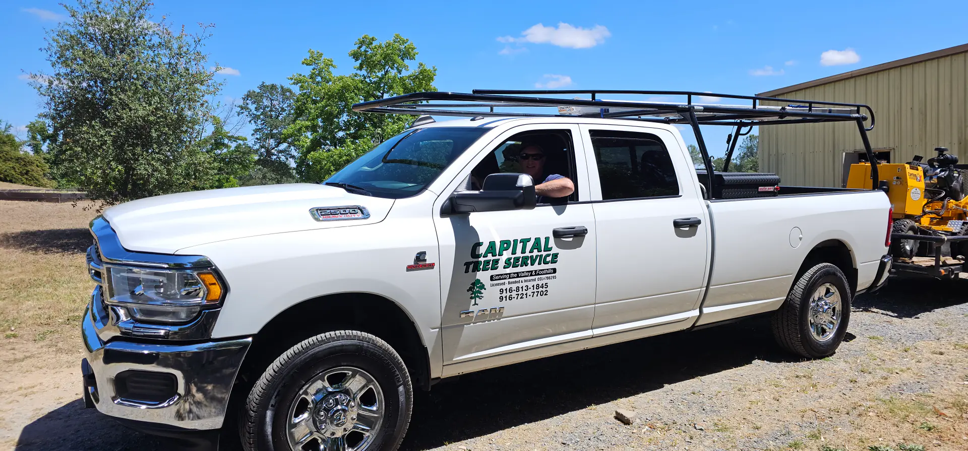 Capital Tree Service truck with stump grinding equipment